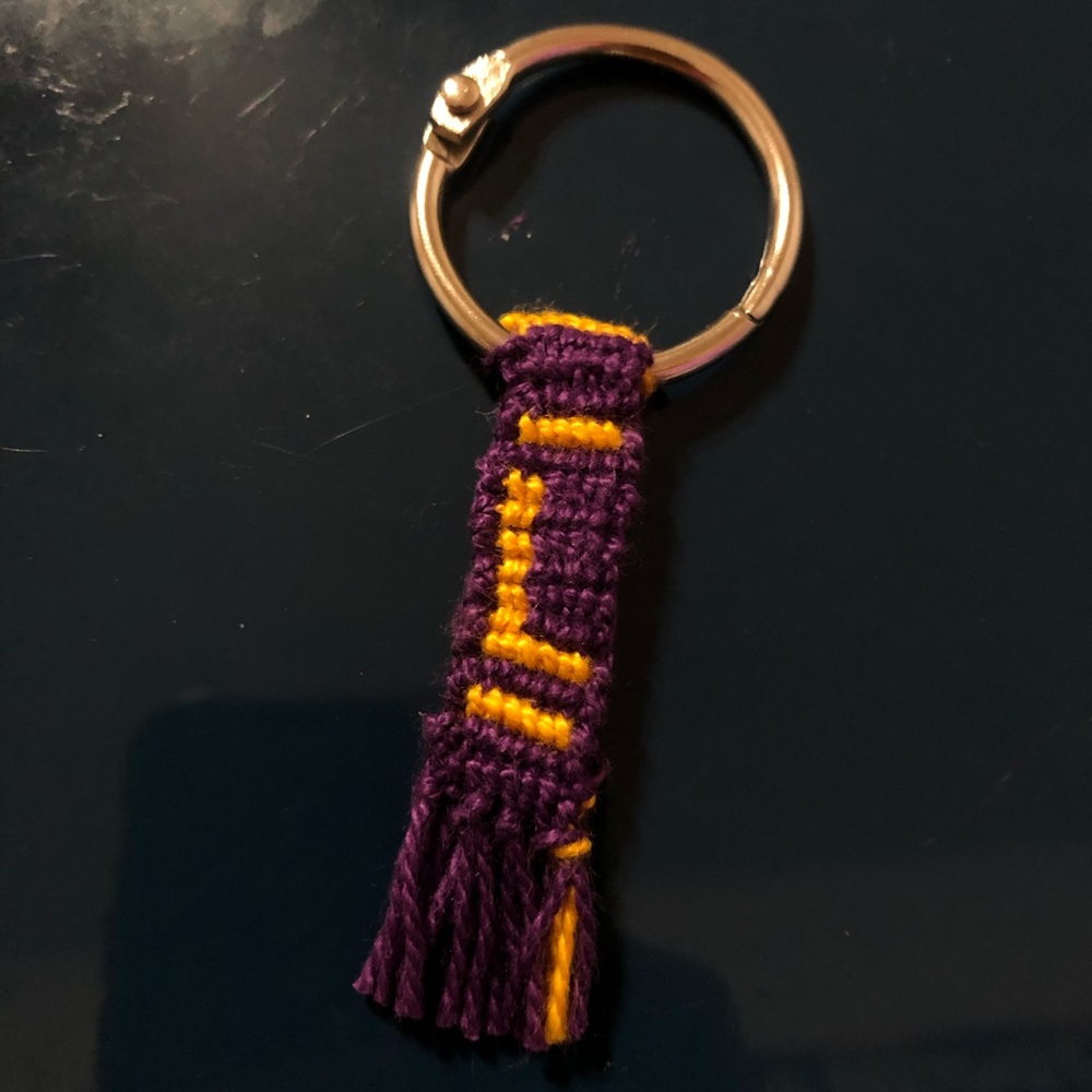 Purple and gold “L” key chain